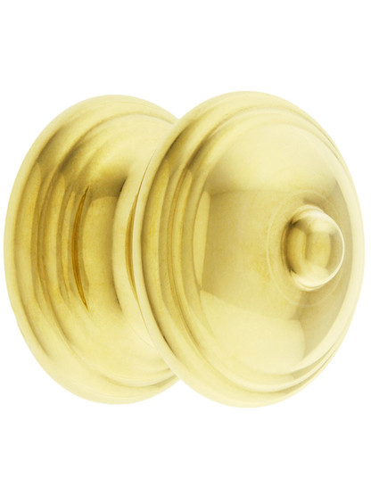 Traditional Brass Cabinet Knob with Turned Base - 1 1/4 inch Diameter in Unlacquered Brass.